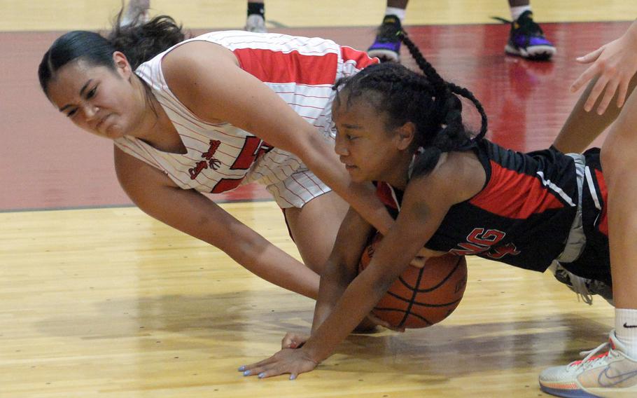 Leona turner and Miu Best battle for the ball.