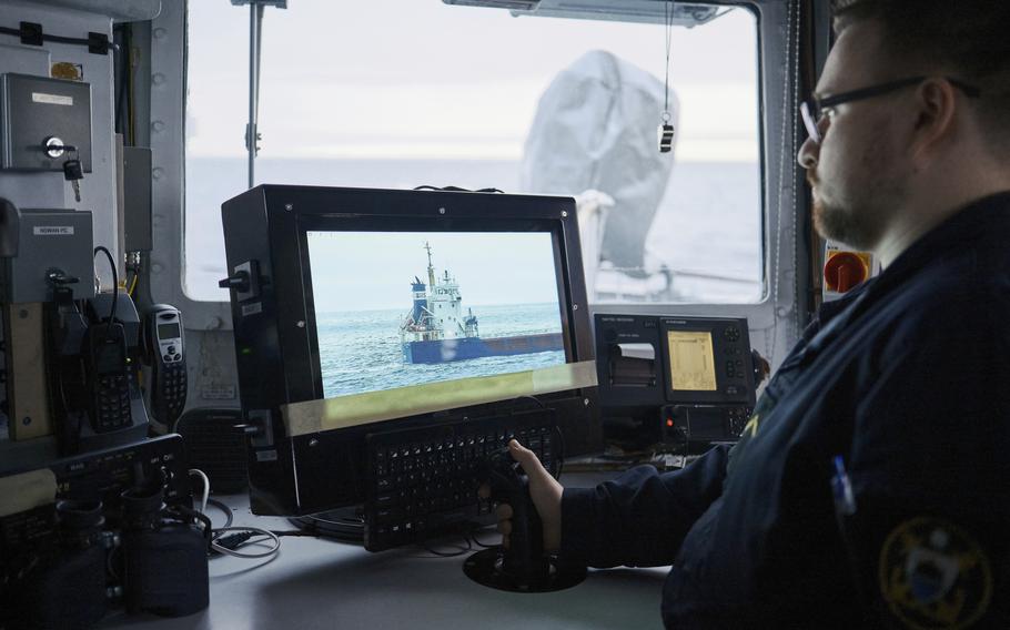 An Estonian sailor monitors a screen showing a platform in the Baltic Sea.