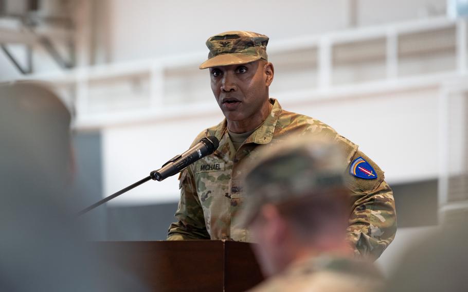 Col. Tracy Michael speaks after assuming command