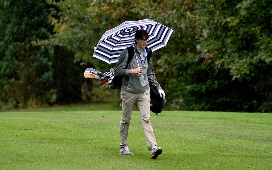 Marcus Freeman walks down the fairway.