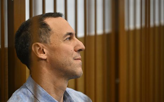 French citizen Laurent Vinatier sits in a cage in a courtroom in the Zamoskvoretsky District Court in Moscow, Russia, Monday, Sept. 16, 2024. (AP Photo/Dmitry Serebryakov)