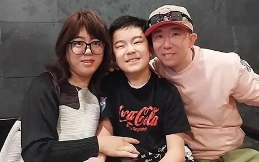 Hao Y. Li with his wife and son