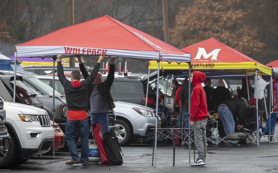 North Carolina State fans set up a tent Saturday, Dec. 28, 2024, to tailgate before the Military Bowl matchup between East Carolina and North Carolina State at Navy-Marine Corps Memorial Stadium in Annapolis, Md. (Eric Kayne/Stars and Stripes)