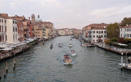 Water taxis and boats make their way across the Grand Canal in Venice, Italy, in 2018. An unidentified U.S. airman is part of an investigation after a stabbing outside a Venice nightclub Sept. 8, 2024.