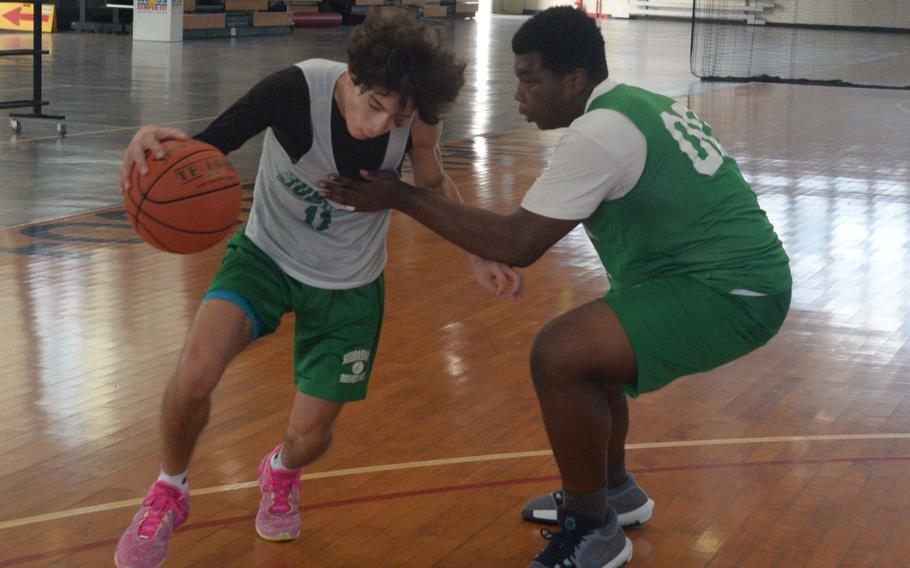 Troy Harris and Isaiah Thompson work out in practice.