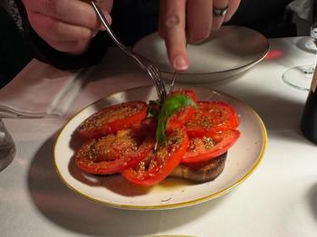 Sliced tomatoes over toasted bread