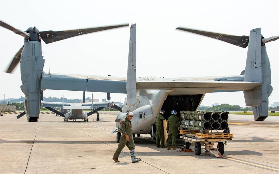 Marines load M142 High Mobility Artillery Rocket System launcher pods onto an MV-22B Osprey at Marine Corps Air Station Futenma, Okinawa, May 8, 2024. 