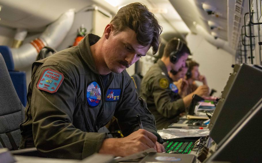 Petty Officer 2nd Class Grant Jones, assigned to Patrol Squadron 45, works aboard a P-8A Poseidon aircraft during an exercise July 9, 2024 over the Black Sea.