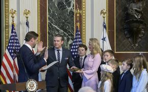 Vice President JD Vance, from left, swears in Pete Hegseth to be Secretary of Defense as his wife Jennifer Rauchet holds the Bible and Hegseth's children watch in the Indian Treaty Room of the Eisenhower Executive Office Building on the White House campus in Washington, Saturday, Jan. 25, 2025. (AP Photo/Rod Lamkey, Jr.)