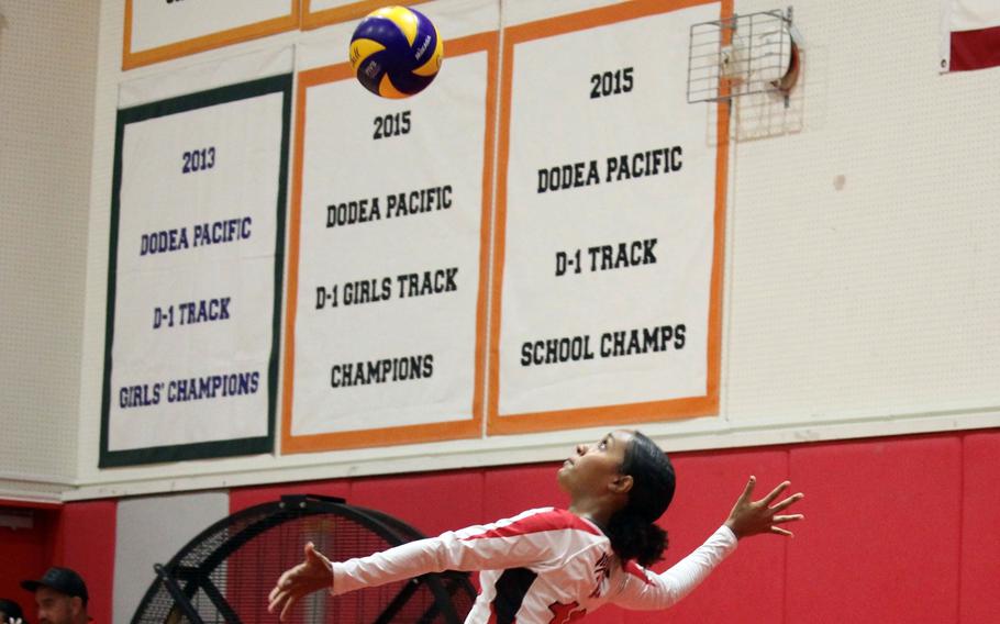 Nile C. Kinnick's Alyssa Staples serves against Christian Academy Japan during Tuesday's Kanto Plain girls volleyball match. The Knights won, taking two out of three sets.