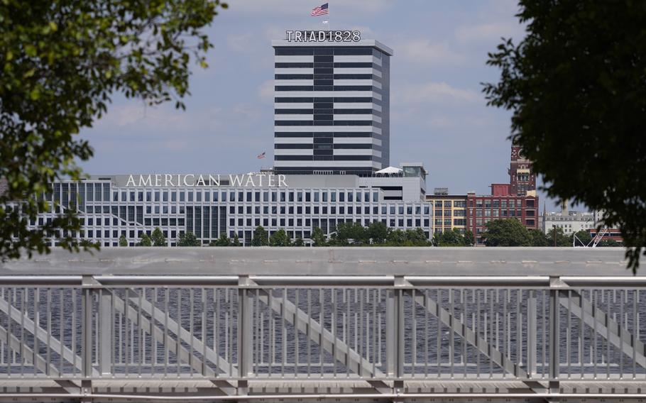 The largest regulated water and wastewater utility company in the U.S., American Water, its building in Camden, N.J., seen in the foreground on June 17, 2024, says it was the victim of a cyberattack, prompting the firm to pause billing to customers.