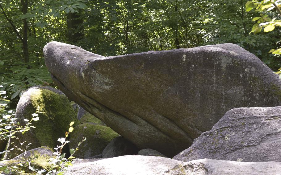 The Crocodile Stone is one of a handful of highlighted geological features along the hiking trails next to the Felsenmeer near Lautertal, Germany.