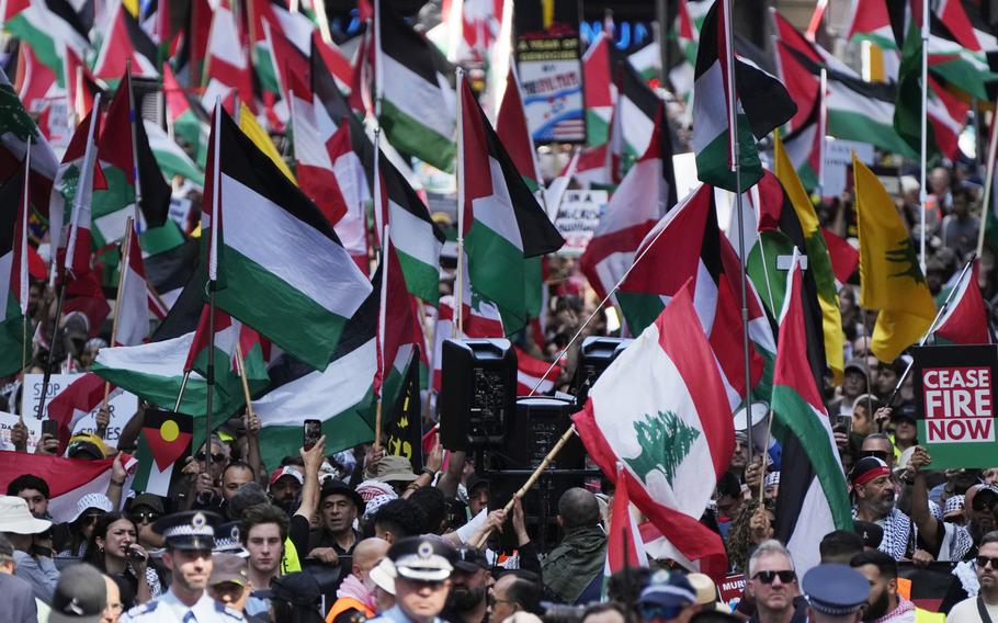 People march on the street as Pro-Palestinian supporters rally in Sydney.