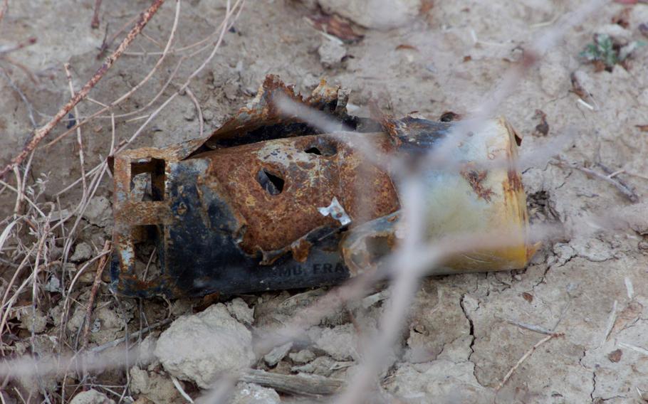 A BLU-97 cluster bomb fragment found near a former Taliban training camp close to Kandahar Air Base, Afghanistan. Photo taken Feb. 27, 2002. 