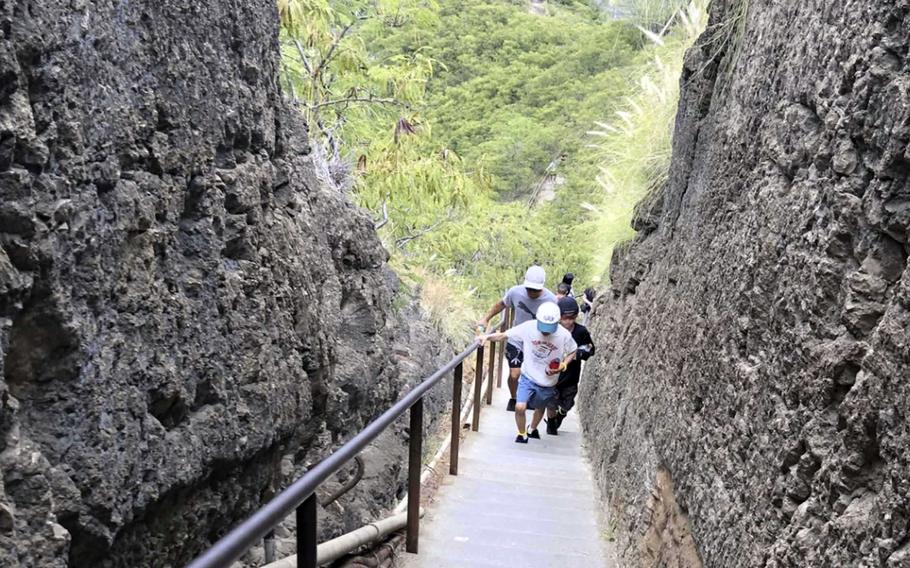 This narrow set of stairs is part of the rigorous course to the top of Diamond Head State Monument on the island of Oahu, Hawaii.