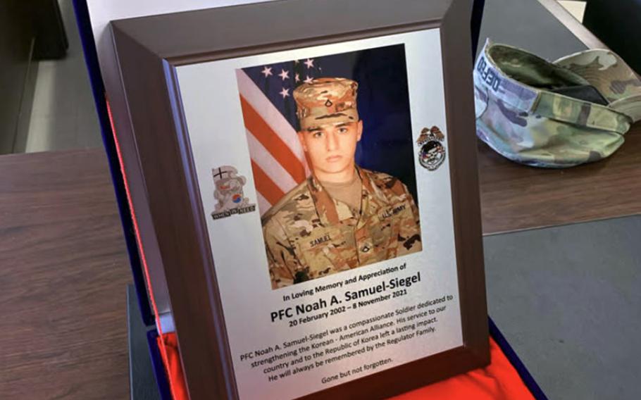 A plaque in remembrance of Pvt. 1st Class Noah Samuel-Siegel, who was found dead in his barracks room at Camph Humphreys, Nov. 8, 2021. 