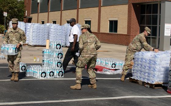 U.S. Army Soldiers with the Hinesville-based 179th Military Police Company, 170th Military Police Battalion, 201st Regional Support Group, Georgia Army National Guard, prepare ice and water for delivery to civilians affected by Hurricane Helene in Augusta, Georgia Oct. 1, 2024. The Georgia National Guard has mobilized to provide response and recovery support to areas in the state impacted by Hurricane Helene. At the direction of the Governor and through The Georgia Emergency Management and Homeland Security Agency (GEMA/HS), the Georgia National Guard will continue to partner local, state, and federal entities in this effort. (U.S. Army National Guard photo by Spc. Kemarvo Smith)