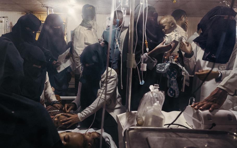 The pediatric ward of the Thaura Hospital in Hodeida, Yemen, is overcrowded and often two or three young patients have to share a bed. 