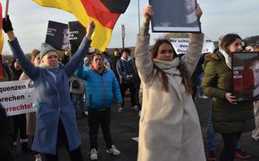 Marchers head toward Spangdahlem Air Base, Germany, on Nov. 24, 2024, to protest a U.S. military court's verdict in the killing of Michael Ovsjannikov. The victim, a martial arts athlete from Wittlich, was stabbed to death Aug. 19, 2023. Airman 1st Class Grant Harrison was acquitted last month of all charges in Ovsjannikov's death.