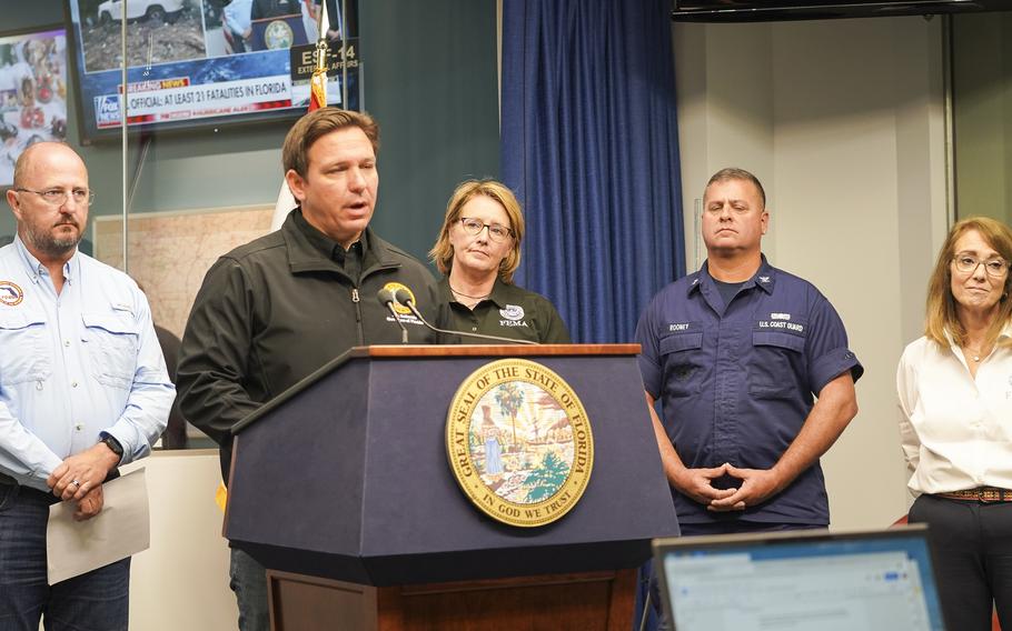 Front, Ron DeSantis giving a briefing on Hurricane Ian recovery with FDEM Director Left, Kevin Guthrie, FEMA Administrator Deanne Criswell, center, USCG Liaison center-right, Captain Paul Rooney and, right, FEMA Region 4 Administrator Gracia Szczech.