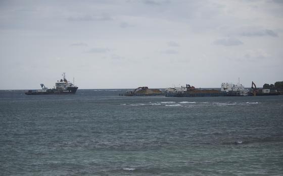 Construction vessels float on Oura Bay at the site of a future U.S. Marine Corps airfield at Camp Schwab, Okinawa, Jan. 23, 2025.