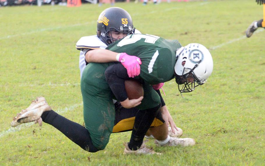 Lukas Gaines gets tackled by Carson Kenderdine.