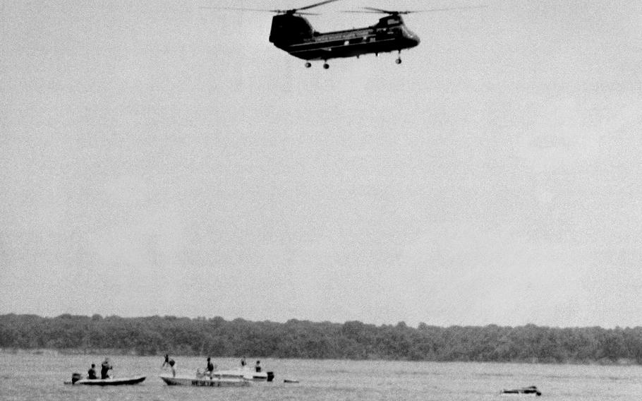 Military rescue workers and boaters arrive on the scene of a Osprey crash in in the Potomac River in 1992.