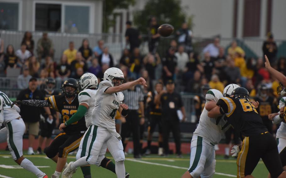 Naples quarterback Camden Kasparek tries to get the ball to an open receiver Friday, Sept. 20, 2024, in the Wildcats’ 28-6 victory over Vicenza.