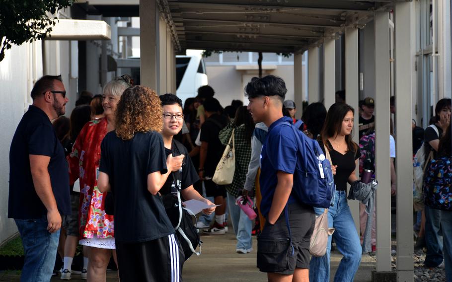 Students gather in Nile C. Kinnick High School's courtyard on the first day of classes at Yokosuka Naval Base, Japan, Monday, Aug. 19, 2024. 