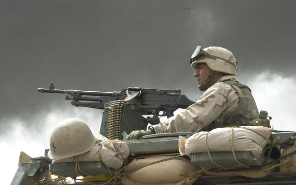 HED: Entering Baghdad, 2003

Baghdad, Iraq, April 8, 2003: A Marine mans a M-240G machine gun on the outskirts of Baghdad, Iraq, as smoke from a burning building billows by.  The Marines entered the city witness to the destruction by air power.  Tanks, armored vehicles and artillery were destroyed all along the routes into the city.           

META TAGS: Marine Corps; USMC; Operation Iraqi Freedom; Wars on Terror;      
