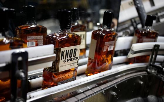 Bottles of Knob Creek brand bourbon whiskey on a conveyor belt in Clermont, Ky.