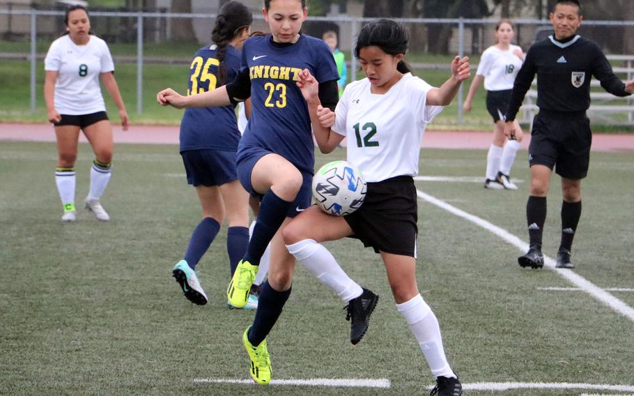 CAJ’s Naya Cummings and Edgren’s Geia Acuzar battle for the ball during Tuesday’s girls Division II soccer match. The Knights won 3-0.