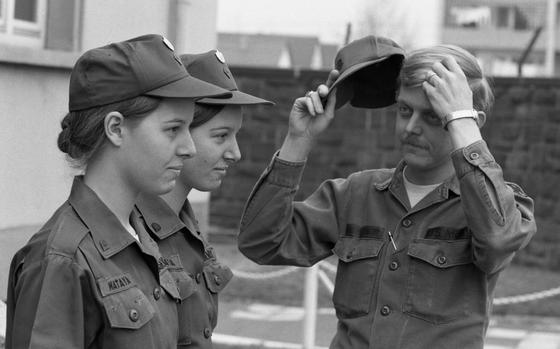 HED: Seeing double, 1976

Karlsruhe, Germany, Feb. 18, 1976: Spec. 5 David Montgomery, company clerk of the 517th Maintenance Co., ponders which of his assistants is which. The clerk-typist twins at Karlsruhe are Patricia (left) and Paula Mataya can be hard to fell apart, even for their boss. 

Did you know today, Dec. 18 is National Twin Day? And although the editors made no mention of it when this photo was first published, the first one was celebrated the same year, in 1976! Check out the original article, and more photos of Patricia and Paula here. 

META TAGS: Army; twins; family; clerk; administration; siblings; sisters; women in the military; military