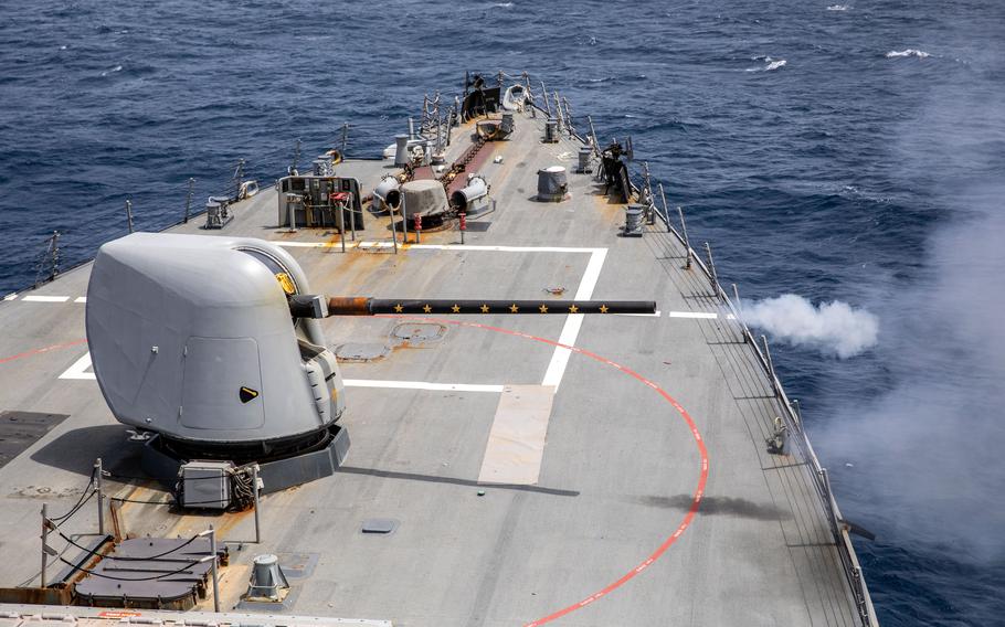 The Mk 45 gun system fires during a live-fire exercise aboard the Arleigh Burke-class, guided-missile destroyer USS Cole on July 19, 2024.