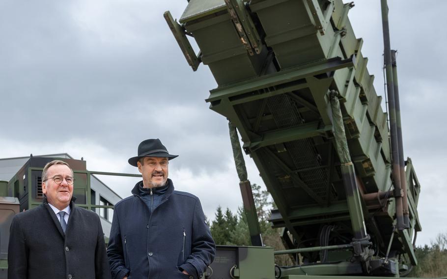 German Defense Minister Boris Pistorius, left, poses in front of a Patriot launcher with Bavarian governor Markus Söder on Nov. 18, 2024, at the groundbreaking of a new assembly line facility that will produce Patriot missiles in Schrobenhausen, Germany.