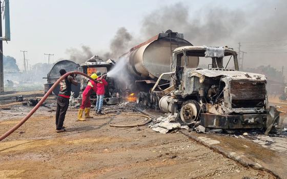 Firefighters extinguish fire from a tanker that exploded in Suleja, Nigeria, Saturday, Jan. 18, 2025. (AP Photo/Arise News)