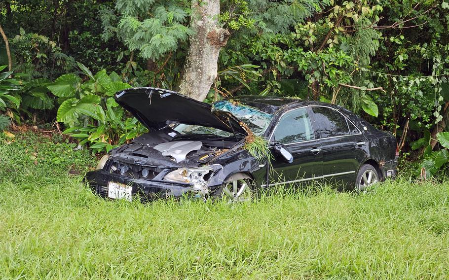 An injured U.S. soldier’s damaged sedan sits inside Kadena Air Base, Okinawa, Monday, Aug. 5, 2024.