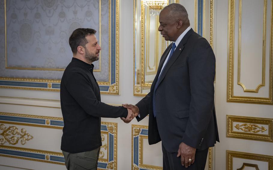 U.S. Secretary of Defense Lloyd Austin, right, and Ukraine’s President Volodymyr Zelenskyy shake hands in Kyiv, Ukraine, Oct. 21, 2024.