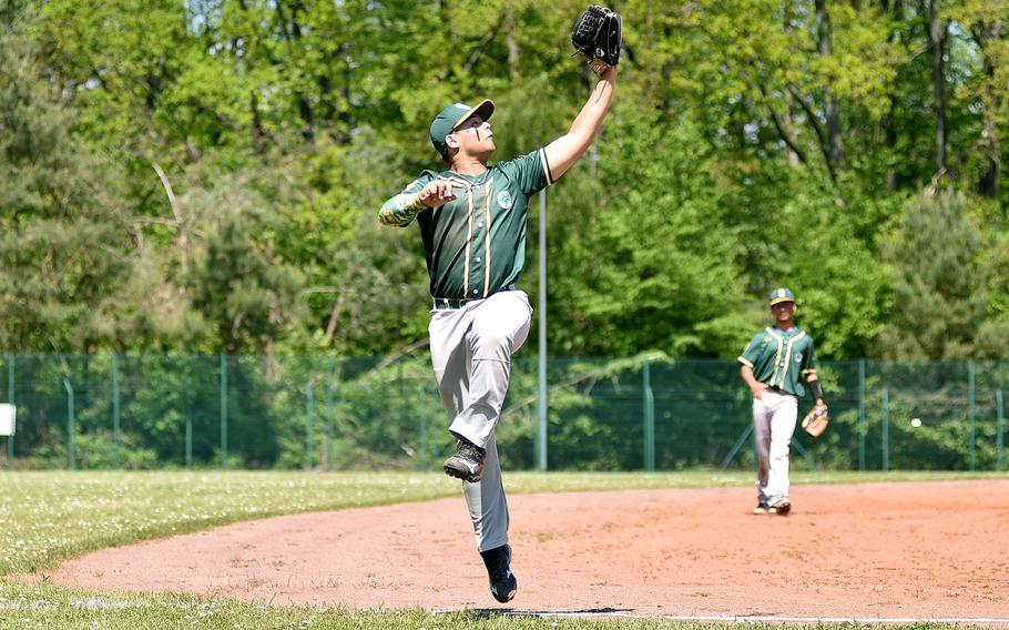 SHAPE third baseman Ethan Simmons leaps to nab a flyball during the third inning of the first game of a doubleheader against Kaiserslautern on May 11, 2024, at Pulaski Park in Kaiserslautern, Germany.