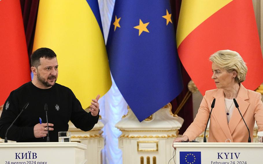 Ukrainian President Volodymyr Zelenskyy, left, speaks during a joint press conference with EU Commission President Ursula von der Leyen at Mariinsky Palace in Kyiv, Ukraine, Saturday, Feb. 24, 2024. The European Union agreed Friday, June 21, 2024, to start membership negotiations with embattled Ukraine and Moldova, another step in the nations' long journey to move closer to the West and mute Russia's influence. 