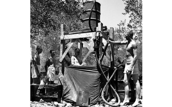 Lebanon, August, 1958: Thanks to typical American ingenuity, soldiers from the 1st Airborne Battle Group, 187th Infantry's supply and transportation platoon were able to enjoy a nice shower during Operation Blue Bat, a mission to back the beleaguered Lebanese government.

Looking for Stars and Stripes’ historic coverage? Subscribe to Stars and Stripes’ historic newspaper archive! We have digitized our 1948-1999 European and Pacific editions, as well as several of our WWII editions and made them available online through https://starsandstripes.newspaperarchive.com/

META TAGS: Lebanon; 1958 invasion of Lebanon; Operation Blue Bat