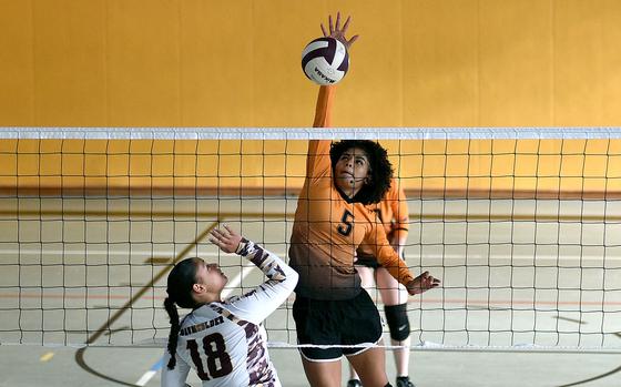 Spangdahlem's Brooklyn Shakir-Bacchus spikes the ball against Baumholder's Kayla Johnson during a match on Sept. 28, 2024, at Baumholder High School in Baumholder, Germany.