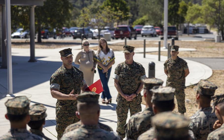 U.S. Marine Corps Staff Sgt. Brett D. Meil speaks on the importance of composure after receiving the Navy and Marine Corps Medal