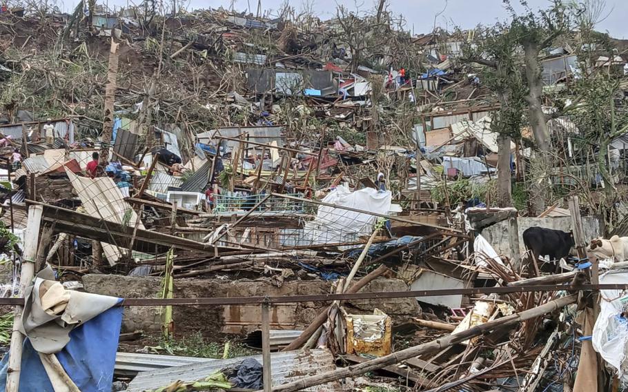 Scattered boards and debris along a hillside.