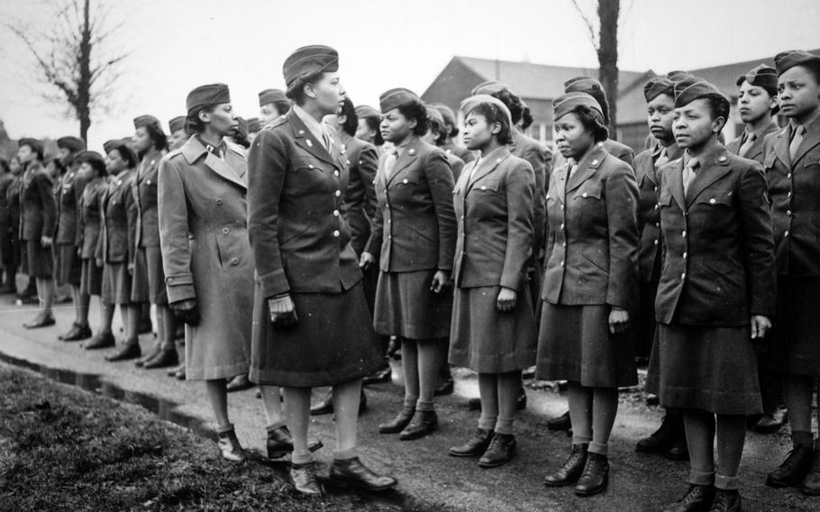 Somewhere in England in February 1945, Maj. Charity E. Adams and Capt. Abbie N. Campbell inspect the first contingent of Black members of the Women's Army Corps assigned to overseas service.