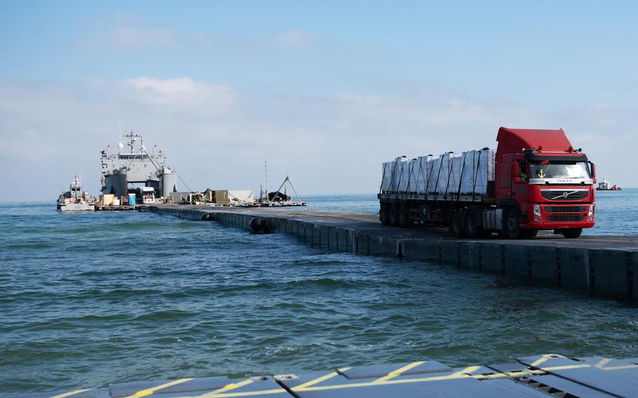 A truck moves humanitarian aid from the temporary pier in Gaza on June 11, 2024.