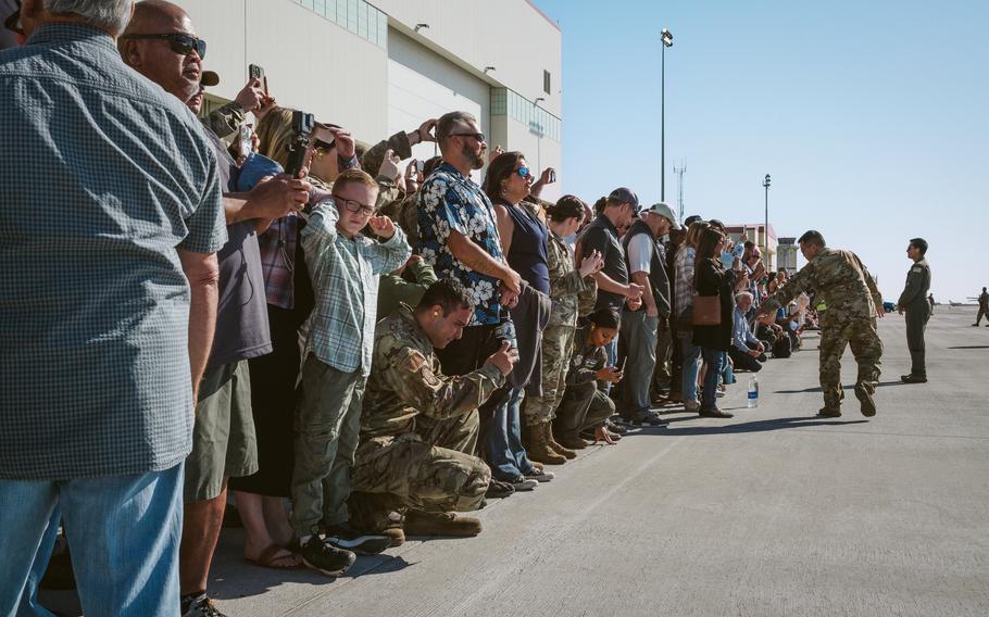 Service members, veterans, military and local community leaders watch as the last KC-10 Extender prepares to take off from Travis Air Force Base, Calif. 