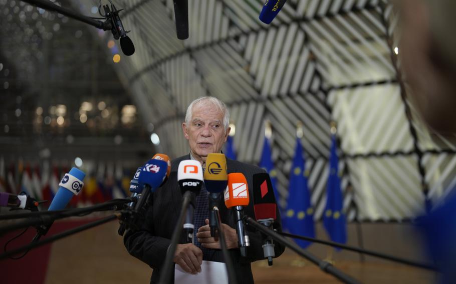 European Union foreign policy chief Josep Borrell speaks with the media as he arrives for a meeting of EU foreign ministers at the European Council building in Brussels, Monday, Dec. 11, 2023. 