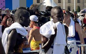 Army Staff Sgt. Leonard Korir, far right, listens to Uganda's Andrew Rotich Kwemoi after finish the men's marathon at the 2024 Paris Olympics on Saturday, Aug. 10, 2024, in Paris. The race marked Korir's second Olympic experience after coming in 14th place in the men's 10-kilometer race during the 2016 Rio Games.