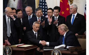 Trump signs a trade agreement with Chinese Vice Premier Liu He on Jan. 15, 2020. 